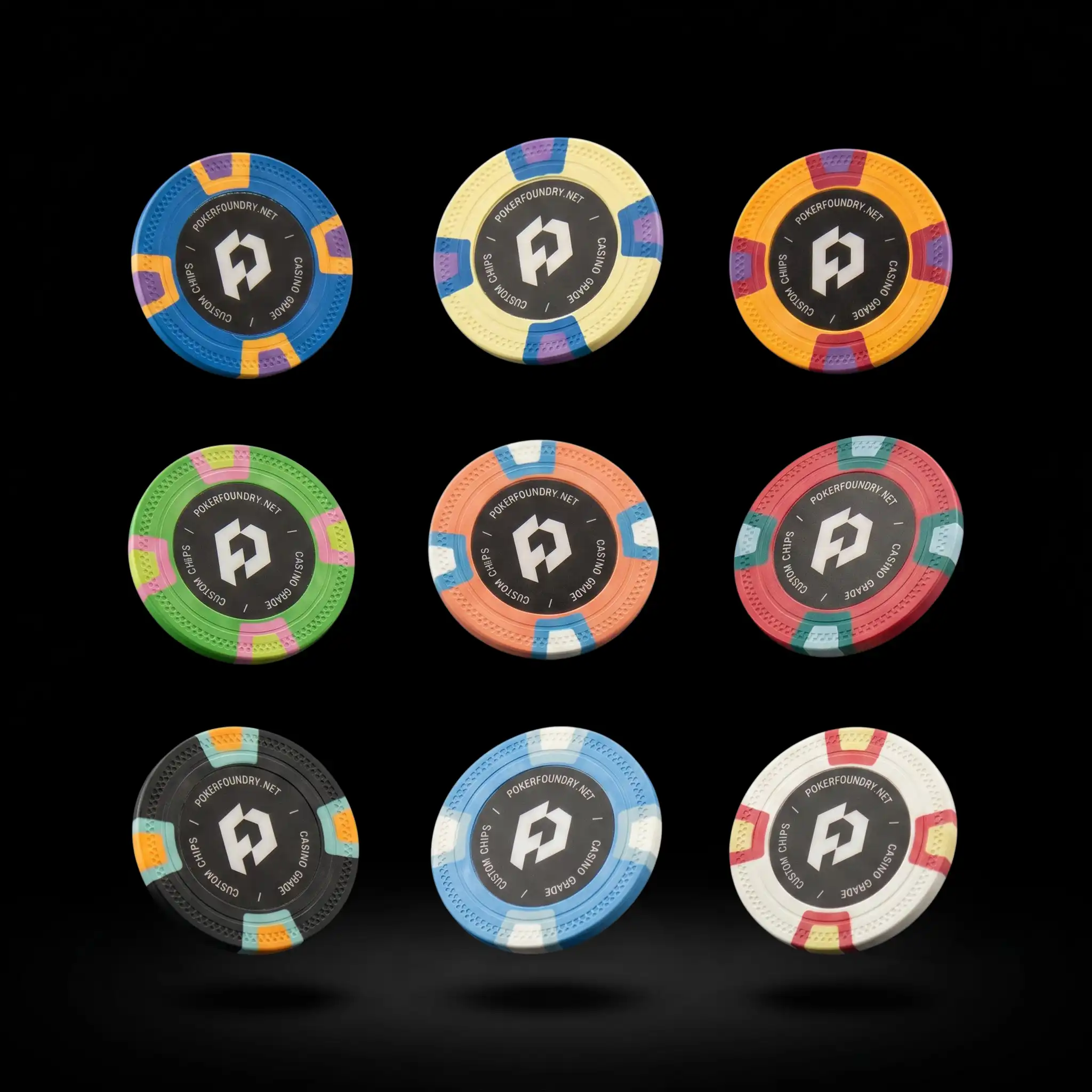 Custom clay poker chips floating on black background — Poker Foundry